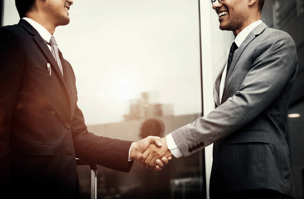 corporate-businessmen-shaking-hands-scaled